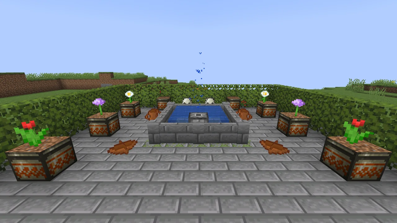 A garden with the fountain spraying in its pool, planter pots full of flowers and clay and bone decorations.