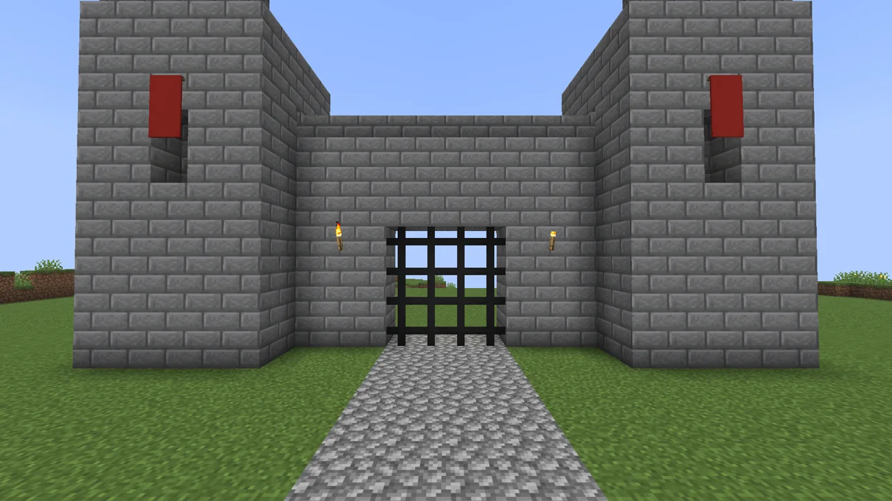 A castle gate hung in a gatehouse, four gates wide that open and close as one.